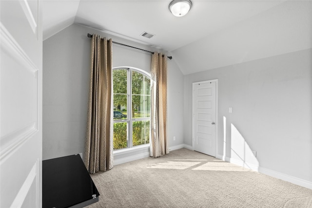 bonus room featuring light carpet and lofted ceiling