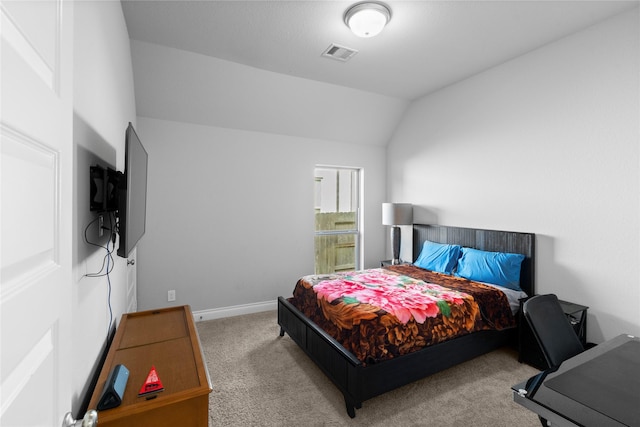 bedroom with carpet flooring and vaulted ceiling