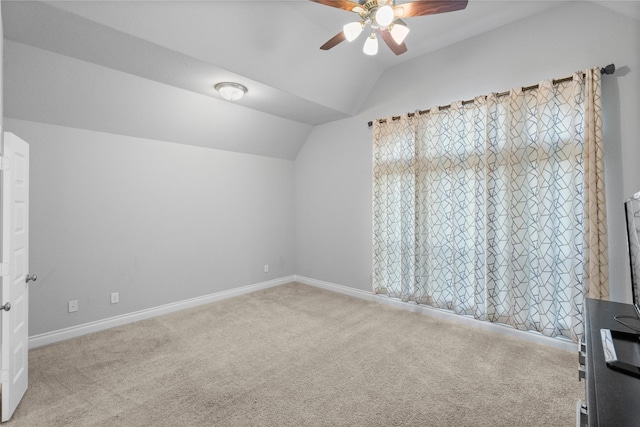 additional living space featuring ceiling fan, light carpet, and lofted ceiling