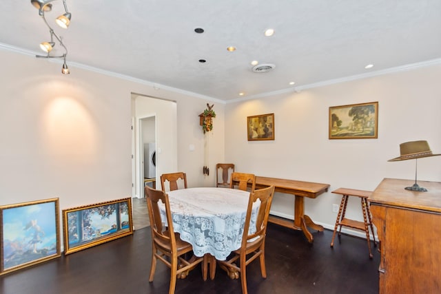 dining area with dark hardwood / wood-style floors and ornamental molding