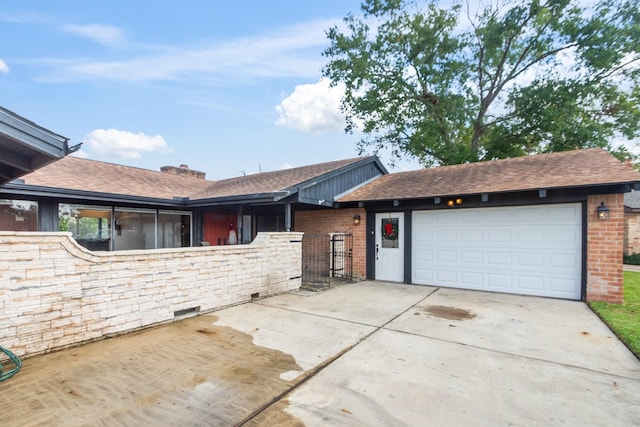 ranch-style house featuring a garage