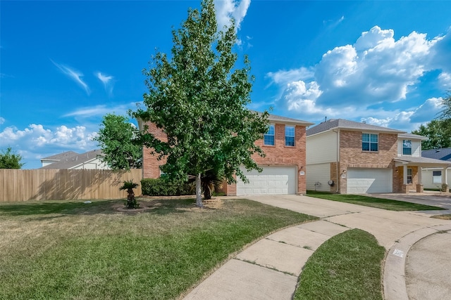 view of front of home featuring a garage and a front lawn