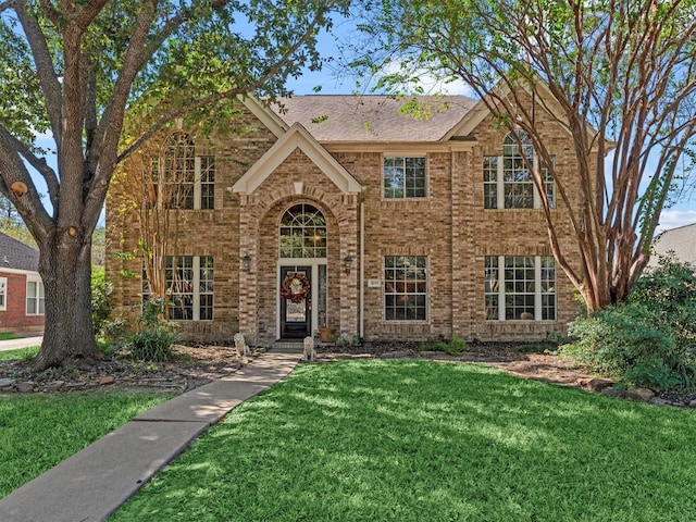 view of front of home with a front lawn