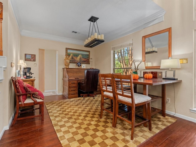 dining area with crown molding and wood-type flooring