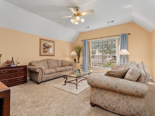 carpeted living room with vaulted ceiling and ceiling fan