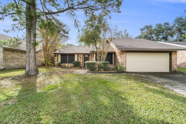 ranch-style home featuring a front yard and a garage