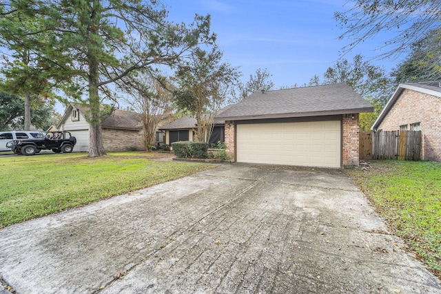 single story home with a garage and a front lawn