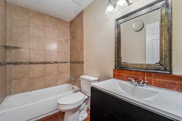 full bathroom featuring tiled shower / bath combo, toilet, a textured ceiling, and vanity