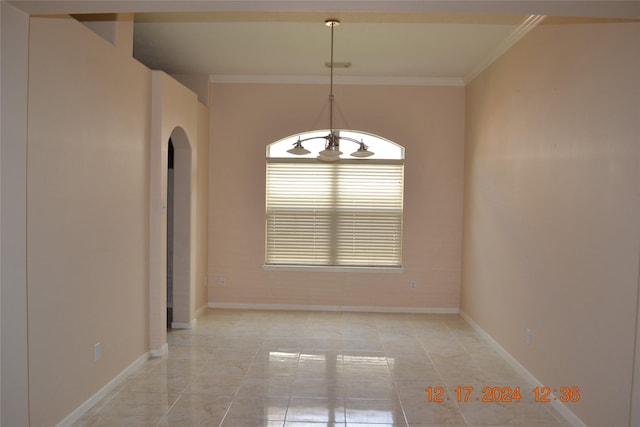 unfurnished dining area with crown molding