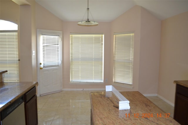 unfurnished dining area with lofted ceiling