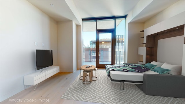 bedroom featuring light wood-type flooring