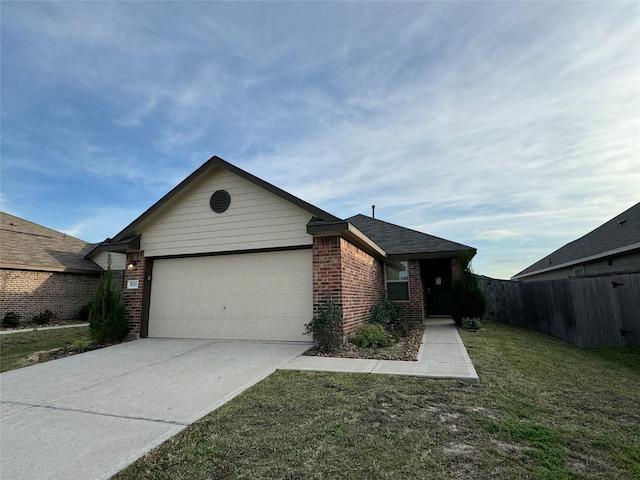 view of front of property with a garage and a front lawn