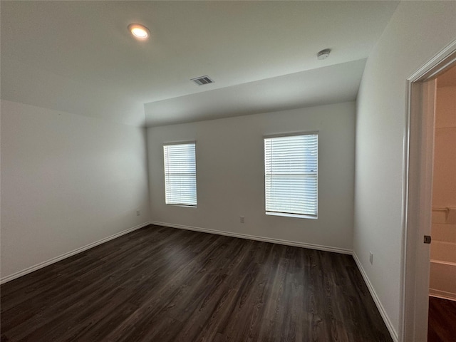 empty room featuring dark wood-type flooring