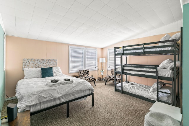 carpeted bedroom with vaulted ceiling