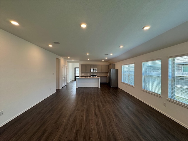 unfurnished living room featuring dark hardwood / wood-style floors