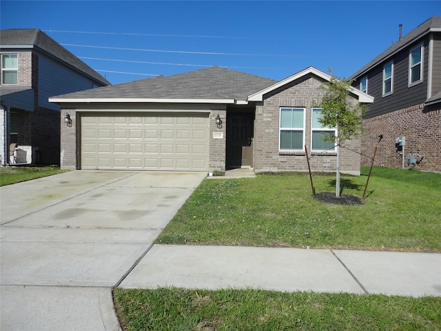 view of front of house with a garage and a front yard