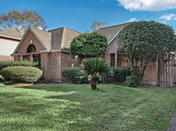 view of property exterior with a lawn