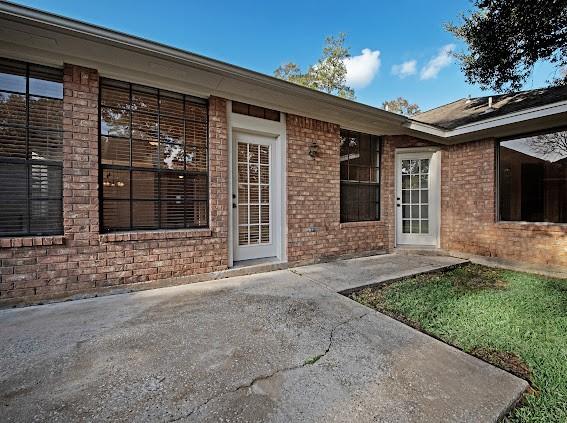 doorway to property featuring a patio