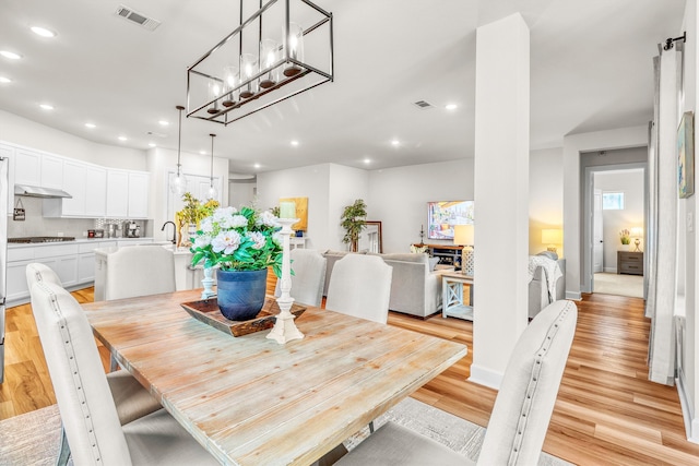 dining area with light hardwood / wood-style floors