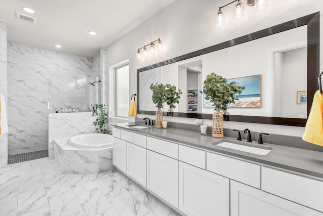 bathroom with separate shower and tub and vanity