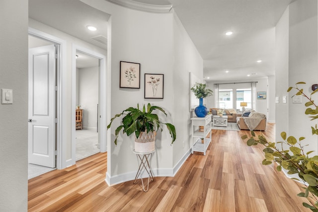 corridor featuring light hardwood / wood-style floors