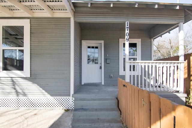 entrance to property featuring a porch