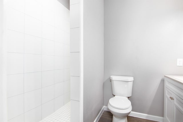 1709 Stevens St, Houston, TX 77026 - bathroom featuring vanity, a tile shower, and wood finished floors