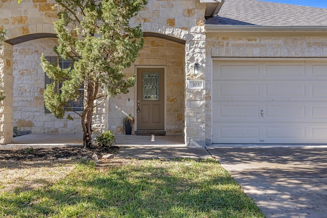 entrance to property featuring a garage