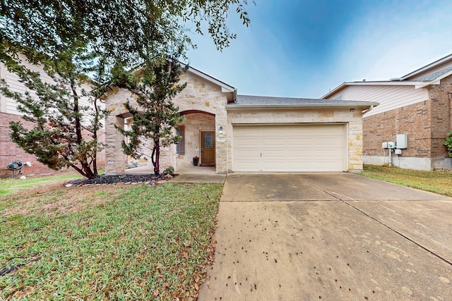 ranch-style house with a garage and a front yard