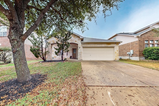 ranch-style house with a garage and a front lawn