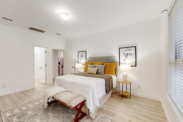 bedroom with light hardwood / wood-style flooring