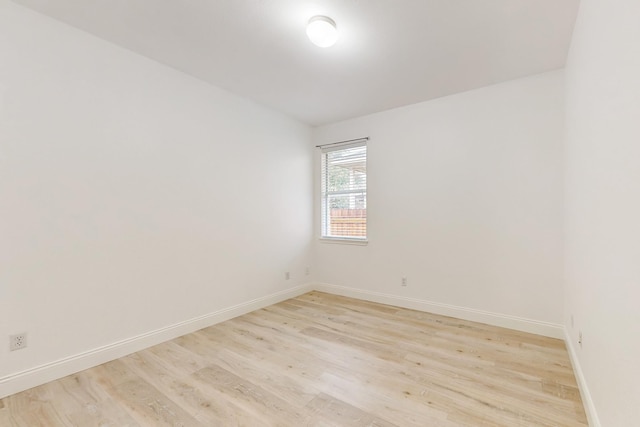 spare room featuring light hardwood / wood-style floors