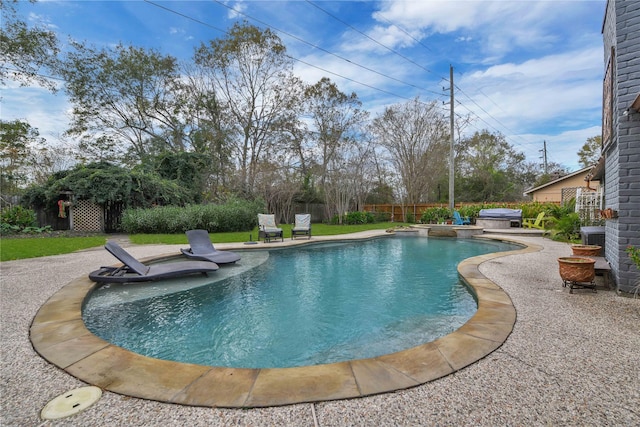 view of swimming pool featuring area for grilling, a hot tub, and a patio area