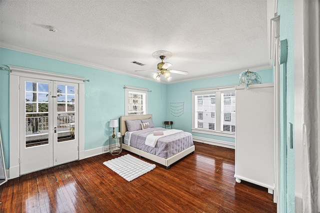 bedroom with ceiling fan, dark wood-type flooring, access to outside, and multiple windows