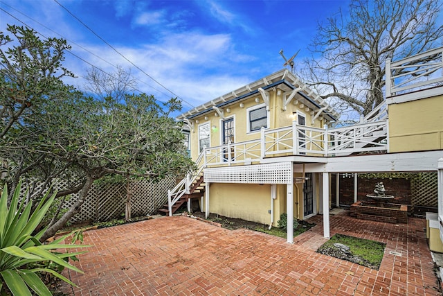 rear view of property with a patio area