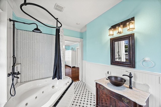 bathroom with vanity, ornamental molding, and shower / bath combo with shower curtain