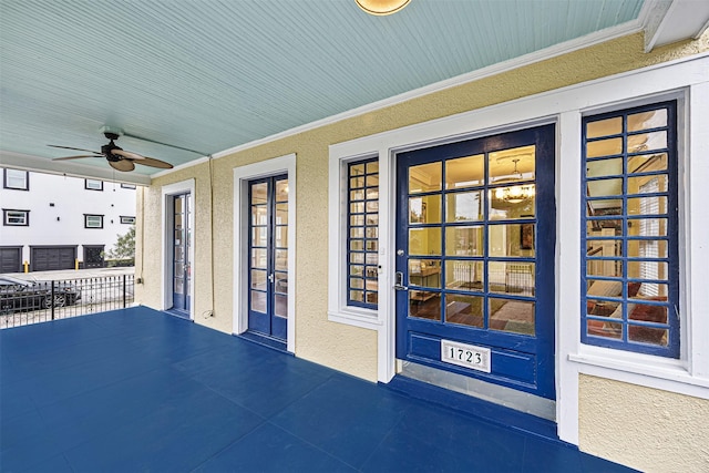 view of patio featuring ceiling fan and a porch