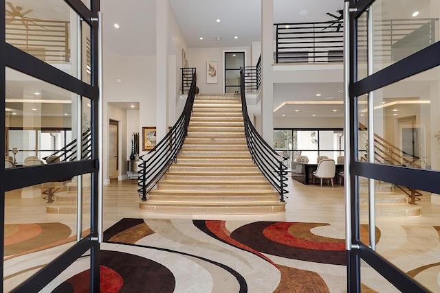 stairway featuring a high ceiling