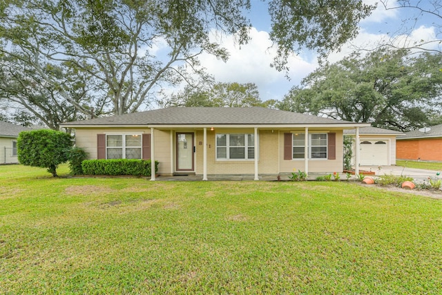 single story home with a front yard and a garage