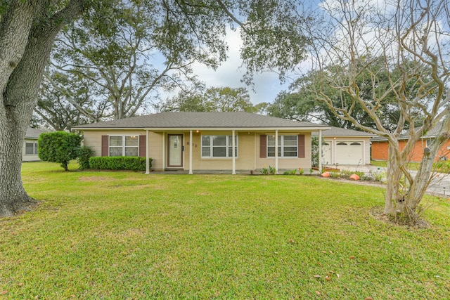 single story home with a garage and a front lawn