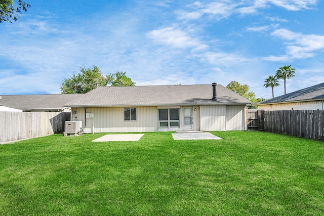 back of property featuring a yard, a patio, and central air condition unit