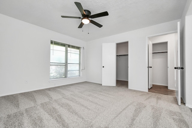 unfurnished bedroom featuring carpet and ceiling fan