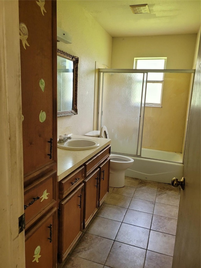 full bathroom with tile patterned flooring, vanity, toilet, and enclosed tub / shower combo