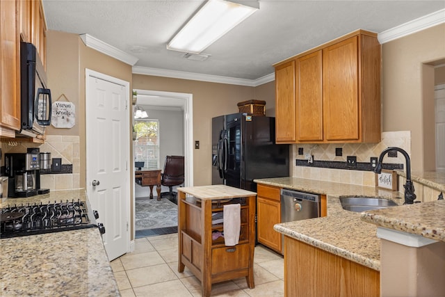 kitchen with black appliances, light tile patterned flooring, sink, and tasteful backsplash