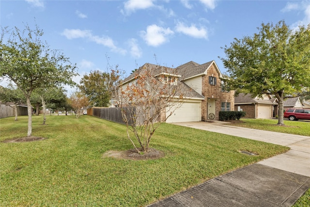 view of front of house featuring a front yard and a garage