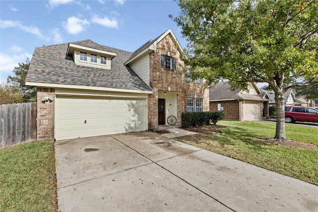 view of front of home with a front yard and a garage