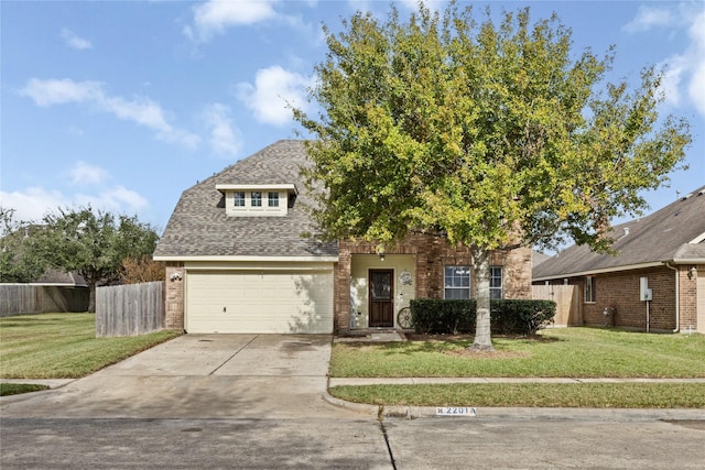 view of front of house with a garage and a front lawn