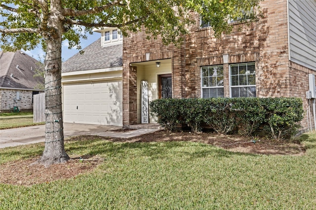 view of front facade with a front yard and a garage