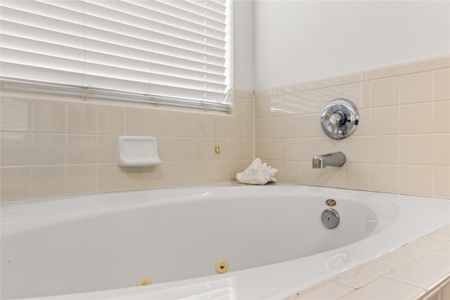 bathroom with tiled tub