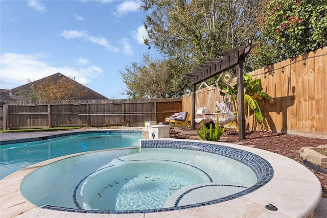 view of swimming pool with an in ground hot tub